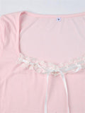 pink knit top with square neckline and lace