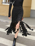 TWOTWINSTYLE Black Cut Out Midi Skirt For Women High Waist Solid Patchwork Tassel Hem Long Skirts Female Fashion Clothing