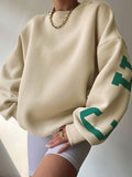 varsity sweatshirt with green letter