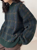 green knitted sweater with check