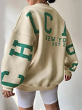varsity sweatshirt with green letter