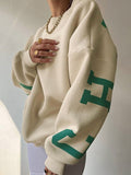 varsity sweatshirt with green letter